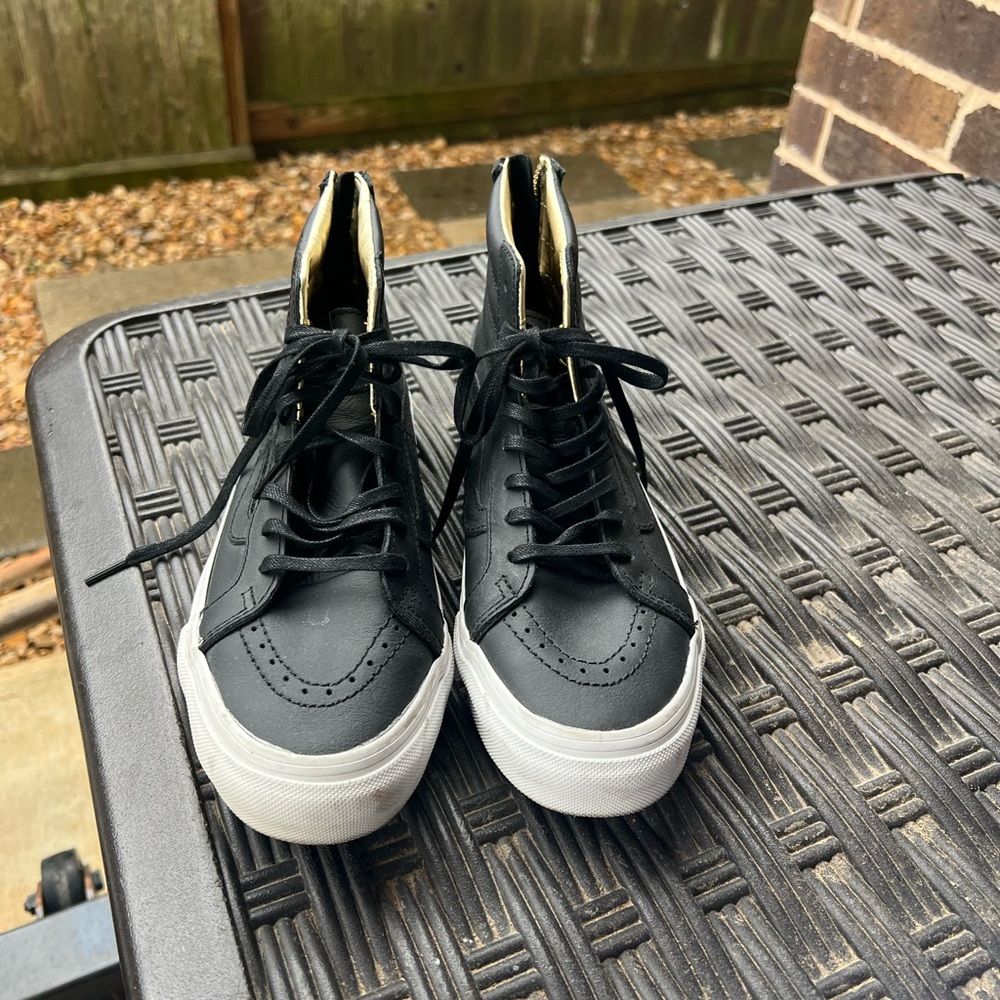 Vans Black and Gold High-Top Sneakers with Classic Design